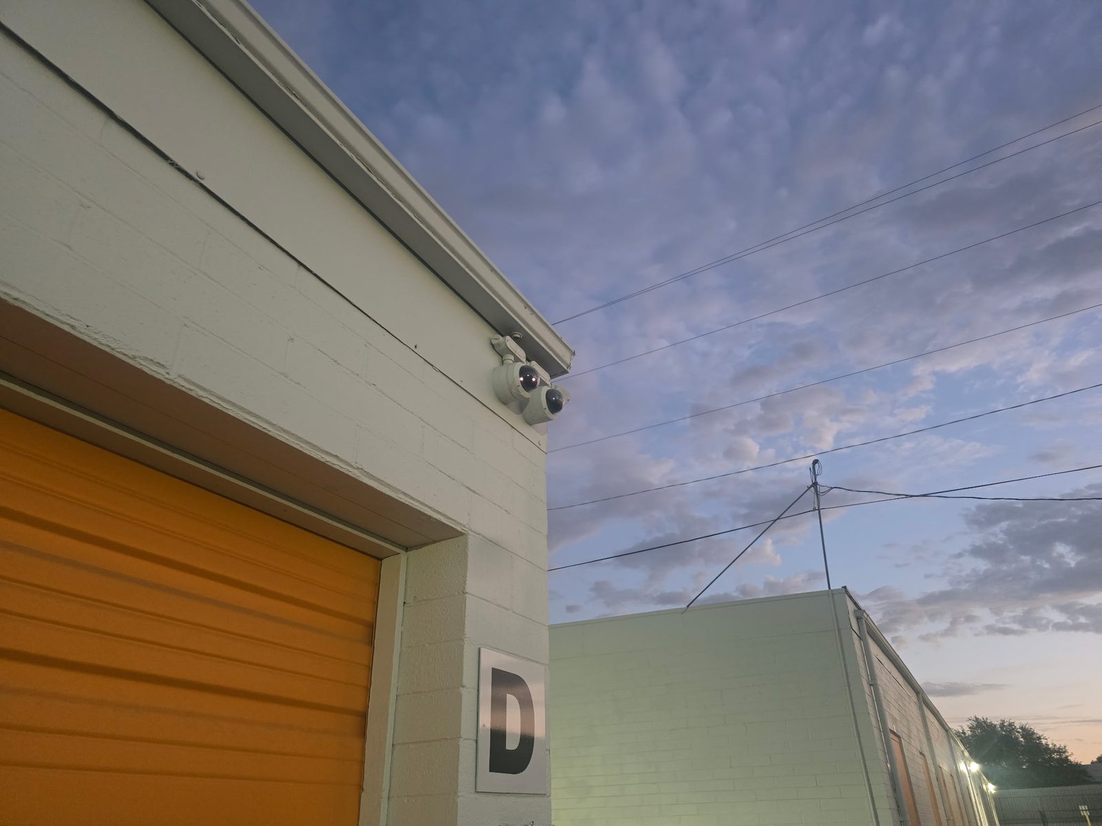 Security cameras mounted above a drive-up unit door at the Tucson facility